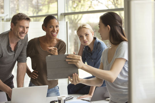 Office workers evaluating proposal