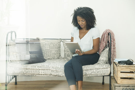 Woman Using Digital Tablet At Home