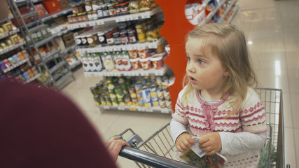 Family makes purchases in the supermarket