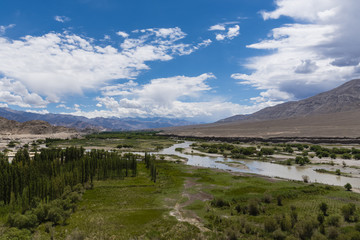 Fototapeta na wymiar Indus river flowing through plains in Ladakh, India, Asia