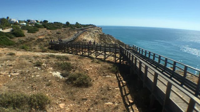 Ocean Viewpoint Walk On Hilltop In Algarve Area, Portugal. The Algarve is the southernmost region of continental Portugal. It is Portugal's most popular holiday destination