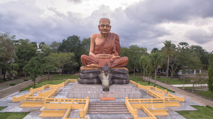 Fototapeta premium the highest pagoda in the world.pagoda has gold color..the temple and pagoda are building in the large field in the embrace of the mountains.