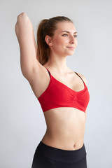 Fototapeta na wymiar young woman doing shoulder stretch