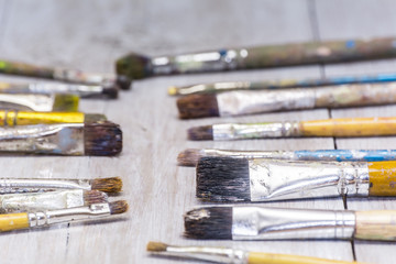 oil paints and paint brushes on a palette