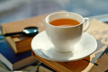 Cup of tea and books, close up