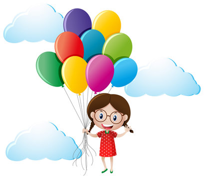 Girl holding colorful balloons