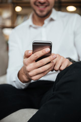 Cropped photo of businessman chatting by phone
