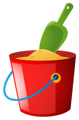 Bucket of sand and green spoon