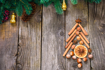 Christmas tree made of nuts, spices and dried oranges. Viewed fr