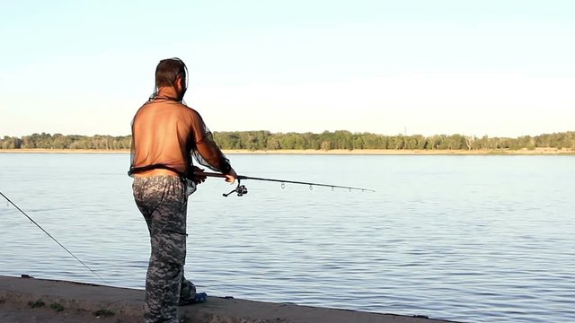 man fishing on a river  