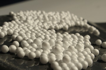 Polystyrene/The white expanded polystyren on dark background.