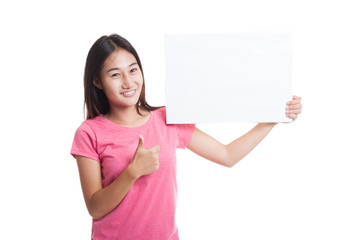 Young Asian woman show thumbs up with  white blank sign