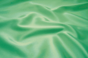 Obraz premium green satin fabric as background