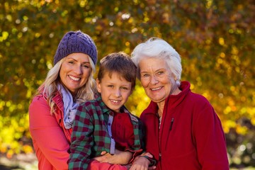 Fototapeta premium Boy with mother and grandmother at park
