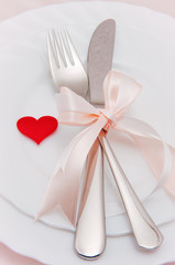 Christmas table place setting with christmas decorations