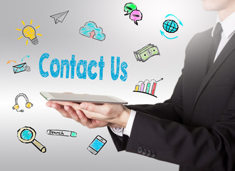Contact Us concept, young man holding a tablet computer