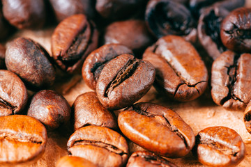Closeup of coffee beans with focus on one