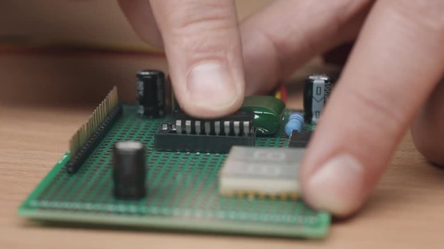Install chip in holder, close up of developer assembly electronic device