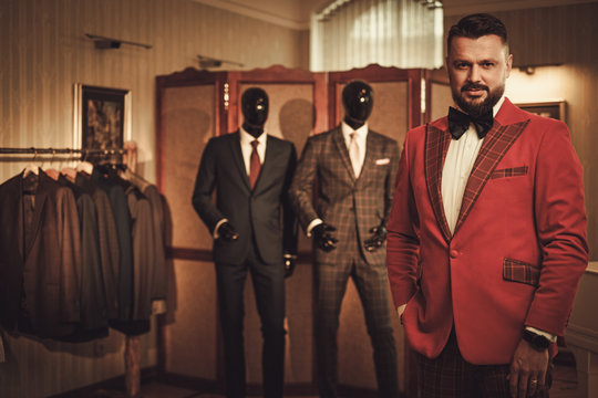 Extravagant stylish man in tailor studio