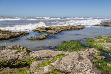 Fototapeta na wymiar Rocks in Guarita beach at Torres