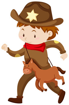 Boy in cowboy outfit with toy horse