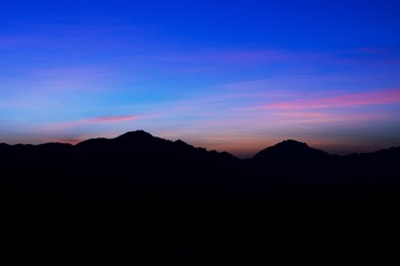 Fototapeta premium Beautiful silhouette landscape at night on a meadow on early winter