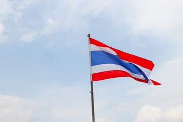 Thai flag, waving in the wind with beautiful with blue sky background