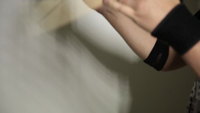 close-up hands of expressive young drummer with drum stick