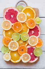 Slices of various citrus fruits (orange, grapeftuit, lemon, mandarine, lime)