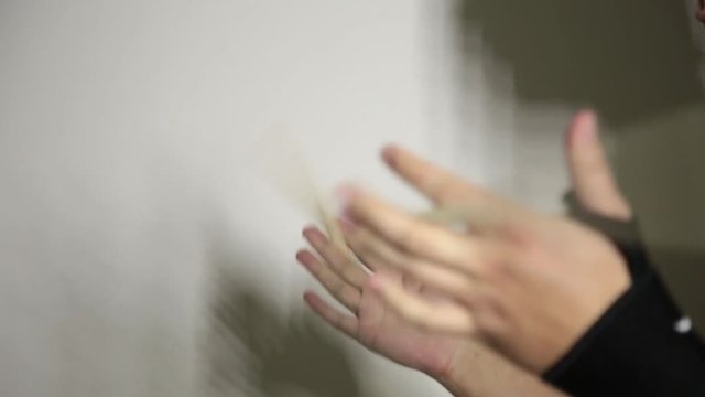 close-up hands of expressive young drummer with drum stick