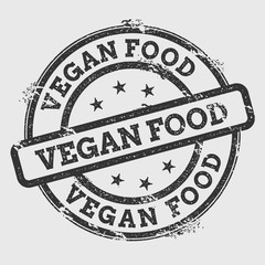 Vegan food rubber stamp isolated on white background. Grunge round seal with text, ink texture and splatter and blots, vector illustration.