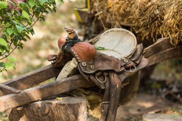 Old leather saddle with braid