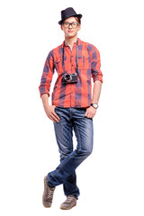 Fototapeta premium Photography hobby. Handsome young man in hat and glasses holding retro camera. Isolated on white.