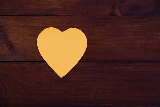 Colorful heart shaped paper on wooden board. Mock up for designers