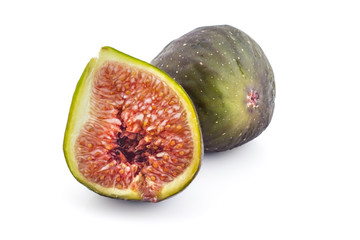 Two fresh ripe organic figs, one cutted in half, isolated on white background