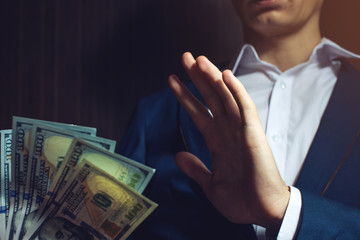 man businessman in suit refuses to take the bribe