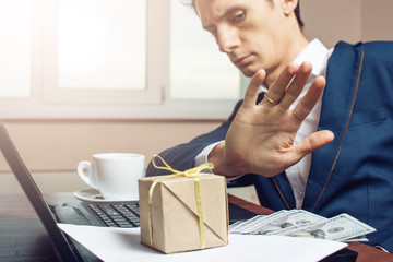 man businessman in suit refuses to take the bribe