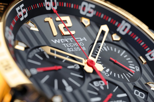 Golden, luxury men’s wristwatch. Clock face close up.