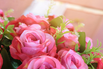 a pink rose bouquet with sun rays in a special day. valentine or wedding day.