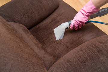 Dirty sofa chemical cleaning with professionally extraction method. Upholstered furniture. Early spring cleaning or regular clean up.