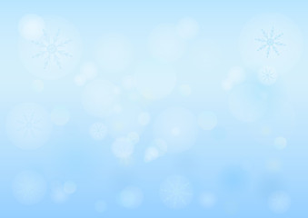 Winter bokeh abstract light background with snowflakes.