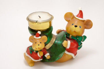 ceramic candle holder Christmas bears with a wax candle isolated on white background
