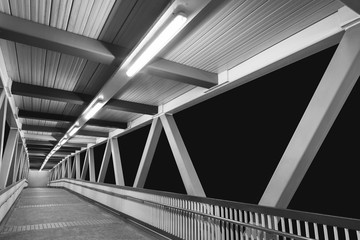 Modern foot bridge in dark