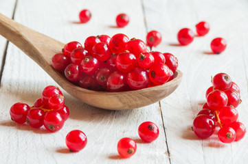 Red currant on wooden table