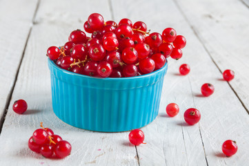 Red currant on wooden table