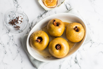 baked apple with cinnamon stick