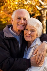 Portrait of elderly couple embracing