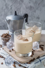 Coffee liqueur in glasses with ice and beans