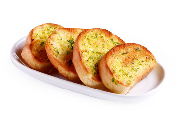 Garlic bread in a plate on white background