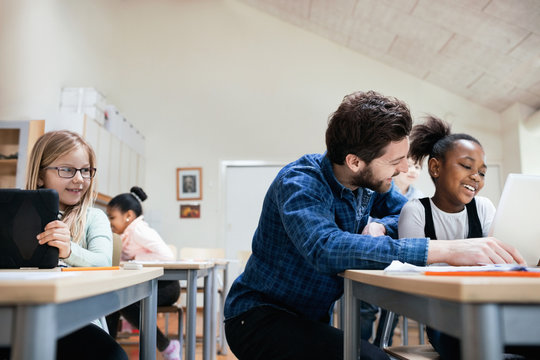 Teacher with pupils in classroom